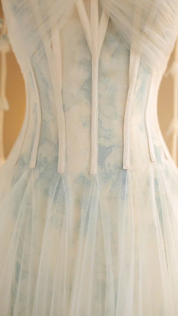 The VEROA Elysian Dream Dress, featuring a corset bodice, delicate spaghetti straps, and a flowing A-line skirt in a soft watercolor print. 